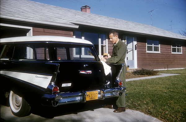 Waxing the car, Oct. 1957